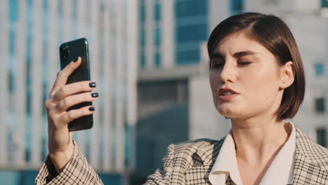 stylish woman using a smartphone outdoor.