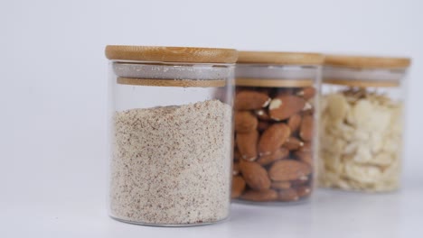 almond flour, almonds, and almond slices in glass jars