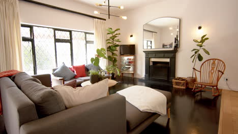 Living room interior with furniture and fireplace at home, slow motion