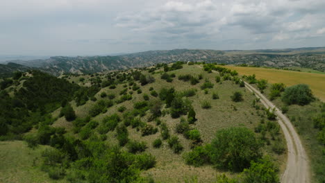 Countryside-Hilly-Area-With-Country-Road-at-Echo-View-Point,-Vashlovani-Nature-Reserve,-Republic-of-Georgia,-Aerial