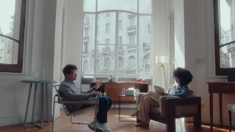 man having counseling session with female therapist