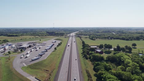 aerial drone footage of a highway with trucks and cars, utah, united states