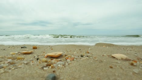 coming wave on a beach from very low perspective