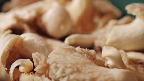 woman hand holds a basket of lung oyster mushrooms. close up of supermarket farmer food.