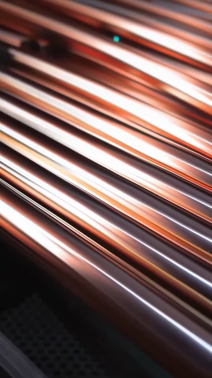 Close-up video of copper pipes with a side angle, showcasing industrial elegance