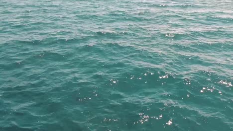 Aerial-view-of-turquoise-seawater-close-to-surface