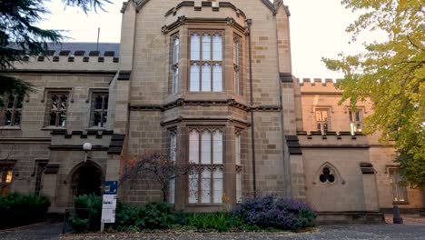 historic building with trees and fallen leaves