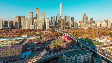 Hyperlapse-Railroad-railway-station-City-center-heavy-traffic-overpass-road,-Cinematic-futuristic-downtown-with-skyscrapers-at-night-with-busy-street-traffics-and-colorful-lights