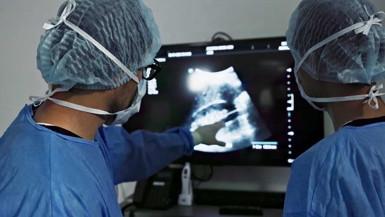 Back, surgery, x ray and a team of doctors