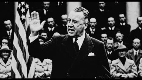 political speech in front of american flags