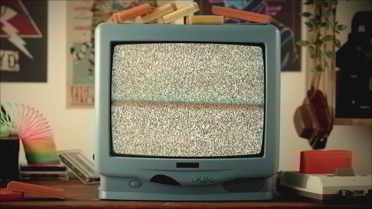 Vintage TV with Static and Retro Gaming Consoles
