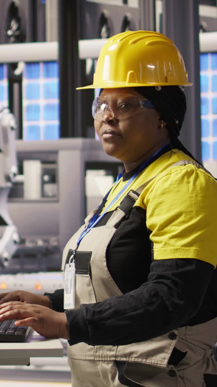 Vertical video Portrait of smiling woman in industry 4.0 solar panels plant