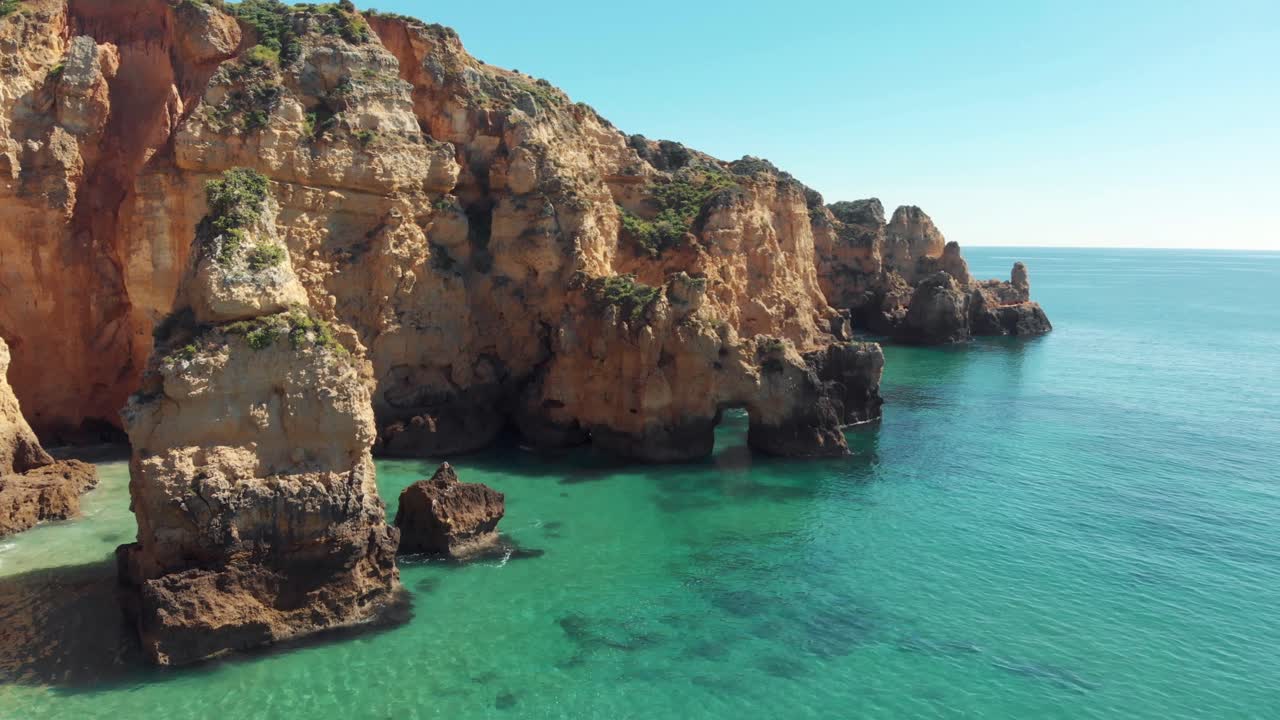 Turquoise clear ocean waters and cliffs, Lagos, Algarve, Portugal