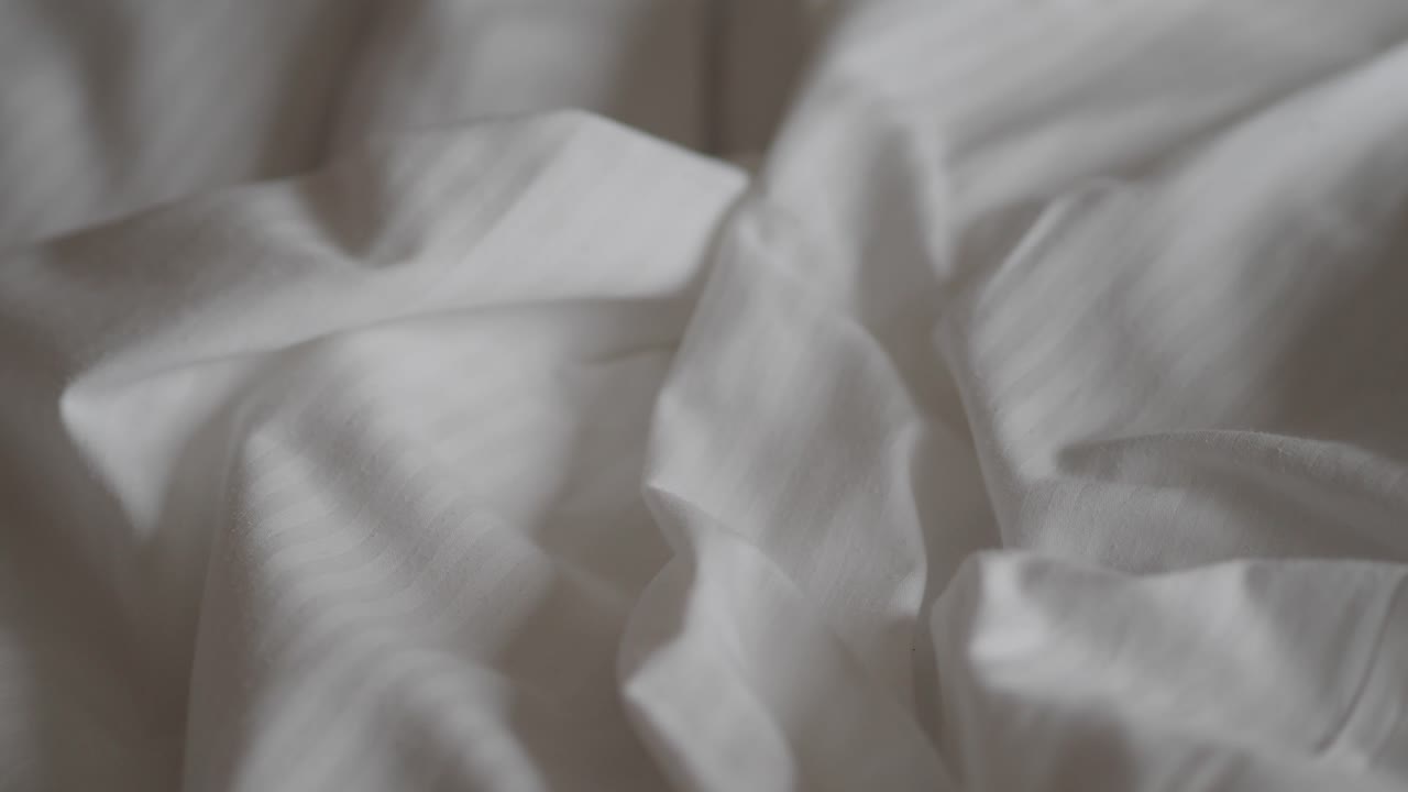 Primo piano della texture di tessuto bianco stropicciato