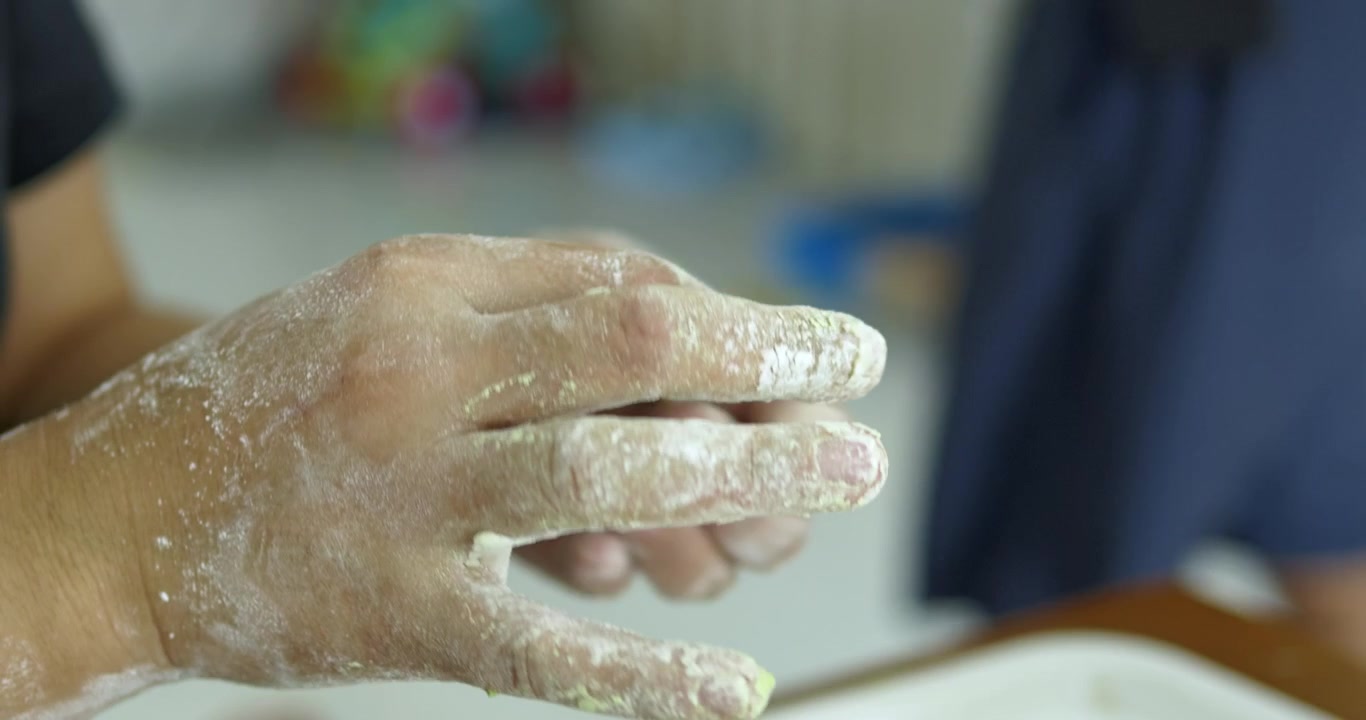 Shaping tiny rice flour balls for bua loi. highlighting the authentic handcrafting culinary process to create the authentic thai bua loi dessert.