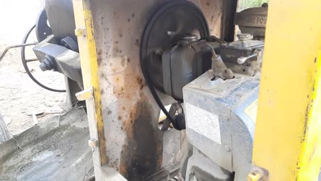 a close-up shot of concrete mixer machine interior diesel engin working at construction site - diesel engine concrete mixer