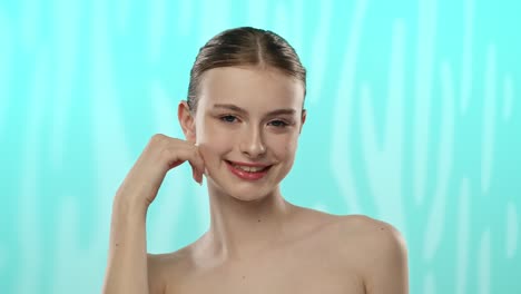 young woman with clear radiant face smiling gently for skincare a young woman with a clear complexion gently touches her face suggesting a skincare theme and youthful radiance