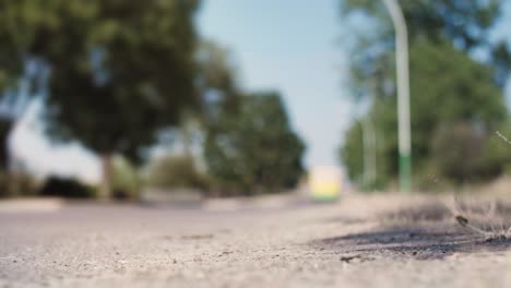 Driver-throwing-away-plastic-bottle-from-car-window-on-road