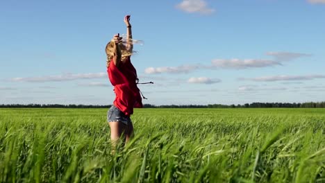 woman jumping in a green field