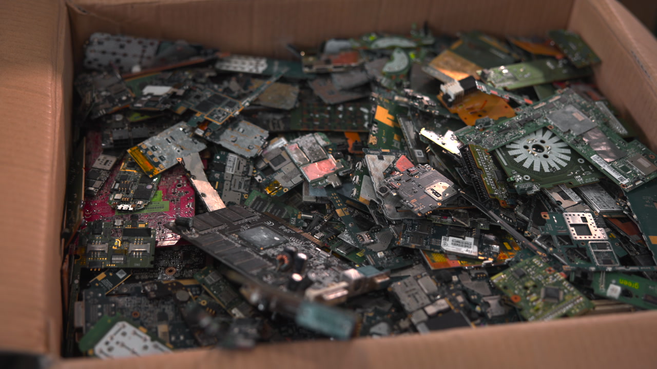 Cardboard Box Packed With Mixed Electronic Parts, Fans, Boards, Connectors And Drive Components, Close Low . Media