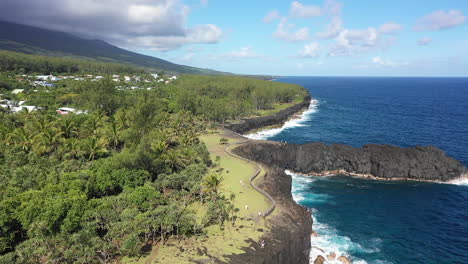 Aerial-view-over-the-Lava-rock-formation-of-Cap-Mechant-and-the-coastline-of-Reunion-Island