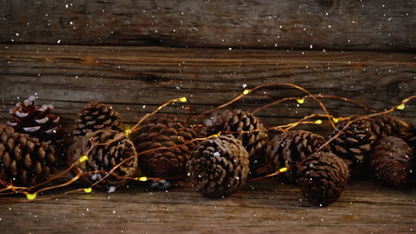 video composition with snow over desk with christmas decoration