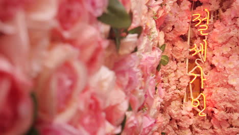 Korean-Sign-at-Restaurant-surrounded-by-Flowers-in-Seoul-South-Korea