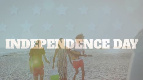 Animation-of-independence-text-banner-over-group-of-diverse-friends-enjoying-at-the-beach