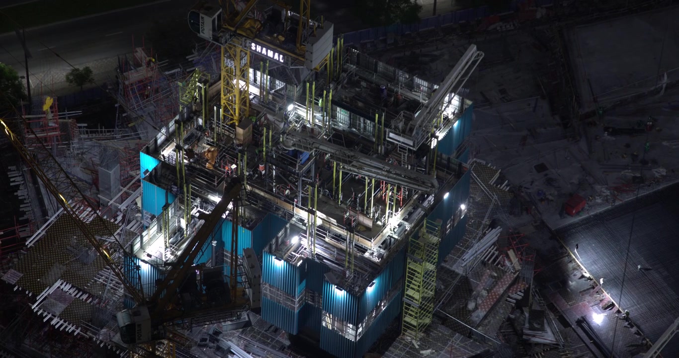 Aerial View of High-Rise Construction Site at Night