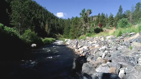 A-fly-fisherman-casts-along-the-banks-of-a-high-mountain-river