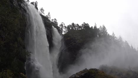 massive hesjedalsfossen waterfall during heavy rain in stamneshella norway