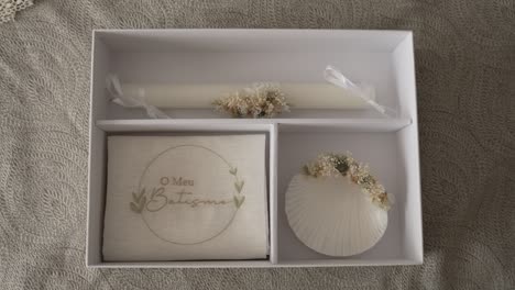 minimal baptism set with candle shell and soft floral details