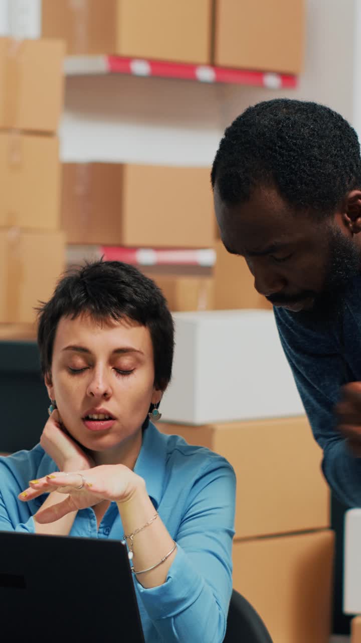 Vertical video: Business partners looking at stock and packaging