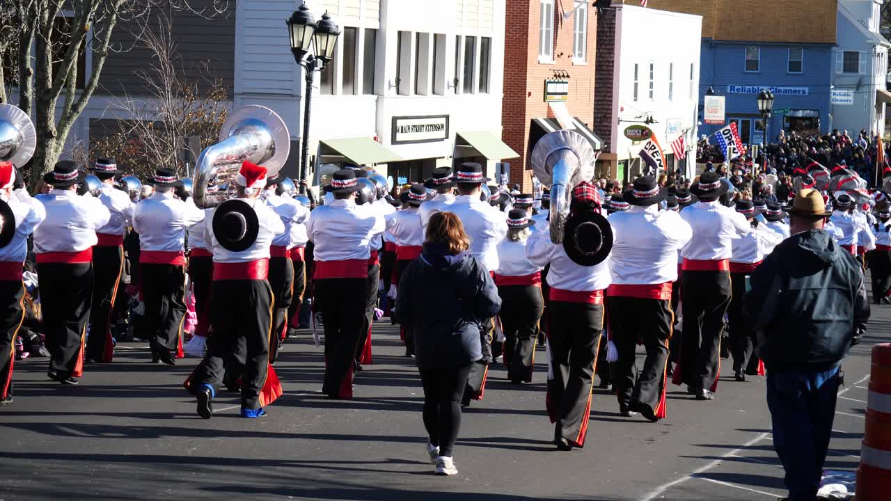Snare Drum Marching Band with Tuba Players walking away from the camera during the Thanksgiving Parade 2019 in Plymouth Massachusetts