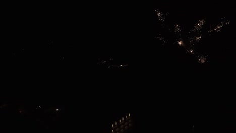firework display in front of large hotel