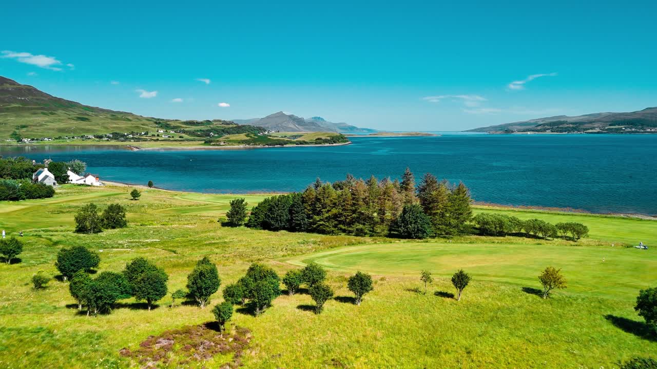 Scenic Golf Course Landscape with Ocean and Mountains