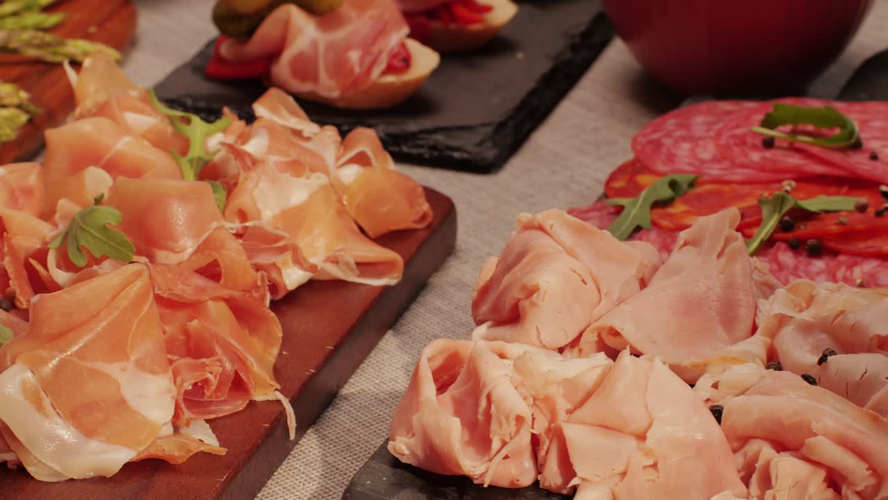 Italian or Spanish restaurant with traditional tapas food, Spanish cuisine, delicious tapas and cheese plate, bruschetta with cheese, olives dry tomatoes and tasty sandwich bar appetizer, buffet