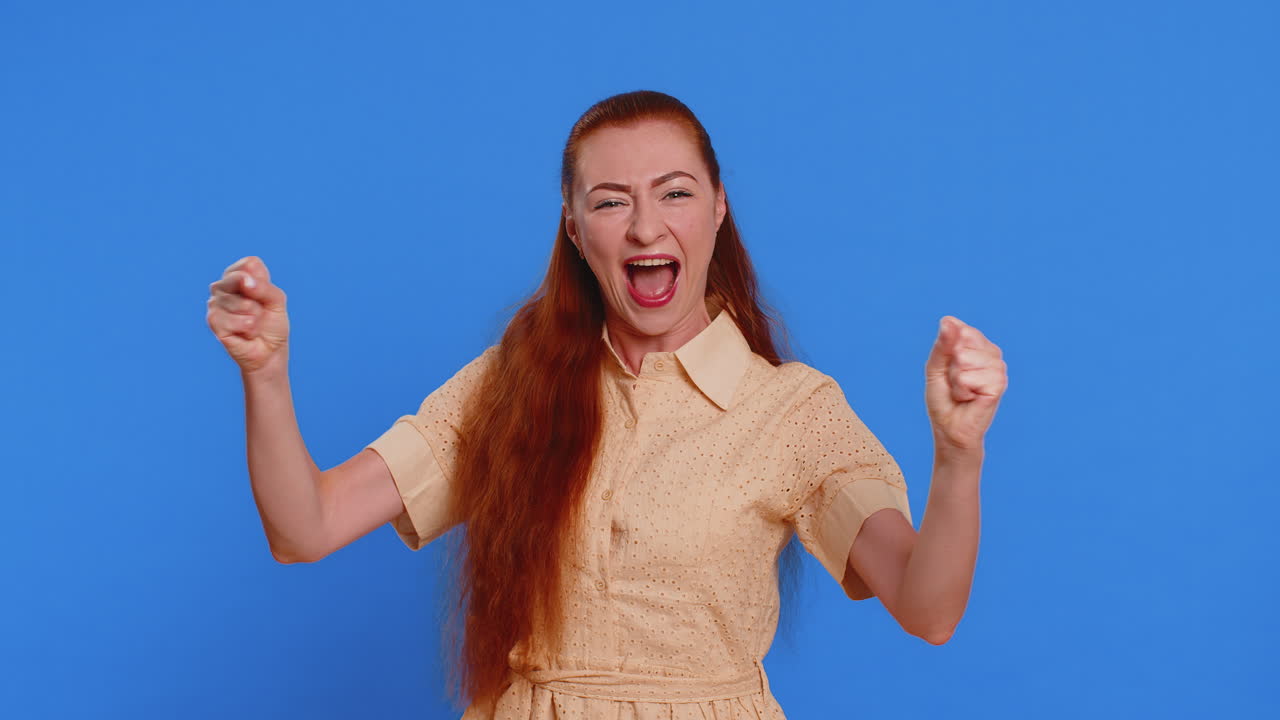 Happy young woman celebrating success winning birthday lottery jackpot goal achievement good news