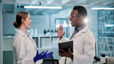 scientists celebrating a successful experiment in the lab