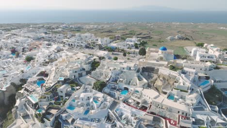 take in the joyous sounds of traditional greek music during local celebrations in santorini from above