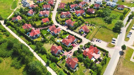 Aerial-view-of-residential-houses-neighborhood-and-apartment-building-complex-at-sunset