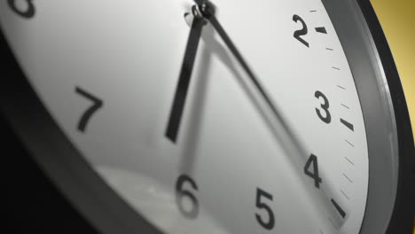 clock face on yellow wall in time lapse