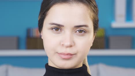 the woman shakes her head negatively, looking at the camera.