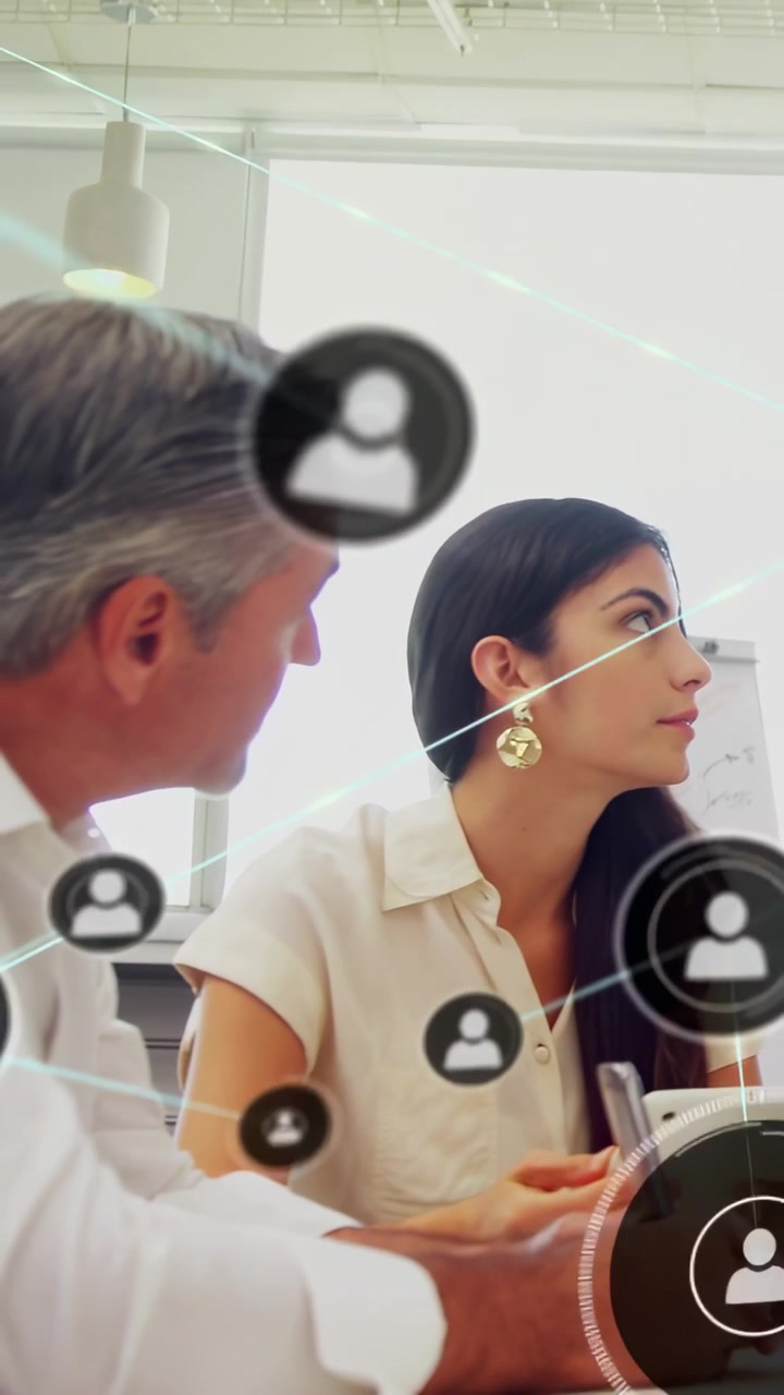 Vertical video: Woman holding tablet turning to follow business slide, animated icons masking faces