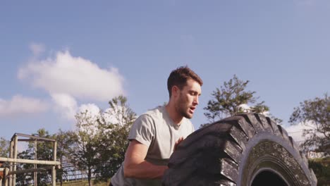 young man training at an outdoor gym bootcamp