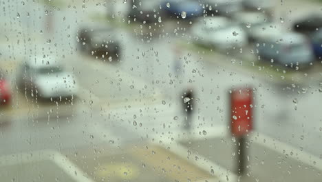 Large-parking-lot-seen-through-window-during-rain