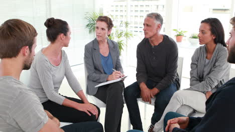 Group-therapy-in-session-sitting-in-a-circle