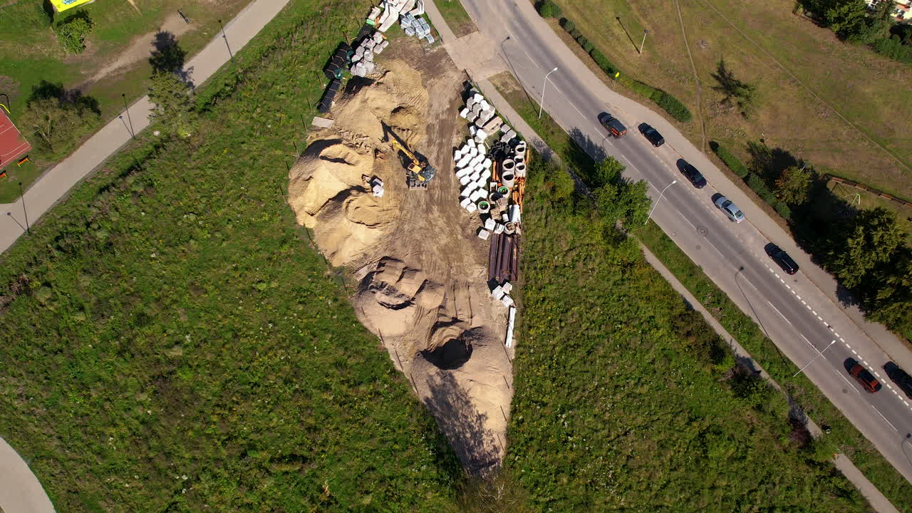 Bird&rsquo;s Eye Drone View of Excavator Clearing Earth on Construction Site