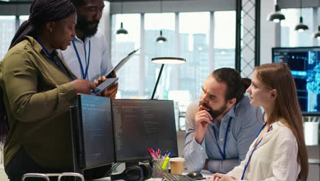 teamworking programmers developing software applications, working together