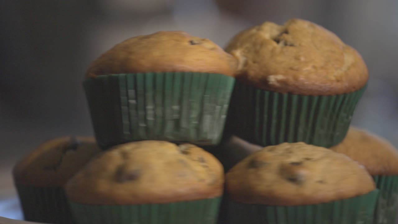 Rotating Tasty Homemade Chocolate Chip Muffin. - close up shot
